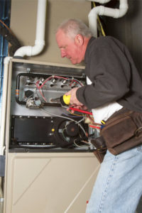 hvac contractor performing a heater repair