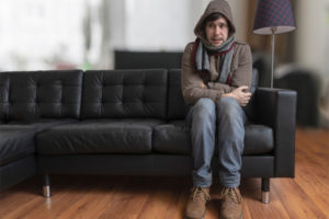 image of a man with a broken furnace