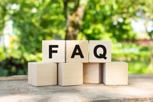 FAQ spelled using wooden letter cubes depicting HVAC Maintenance Agreements questions