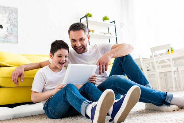 father and son enjoying home heating