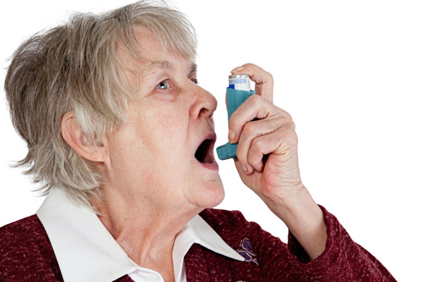 image of a woman with respiratory issues and inhaler