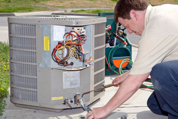 air conditioner technician performing tune-up