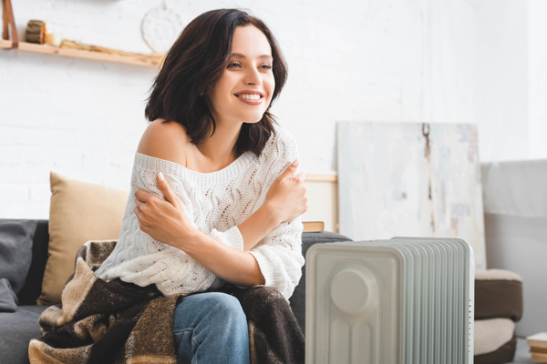 woman with a space heater