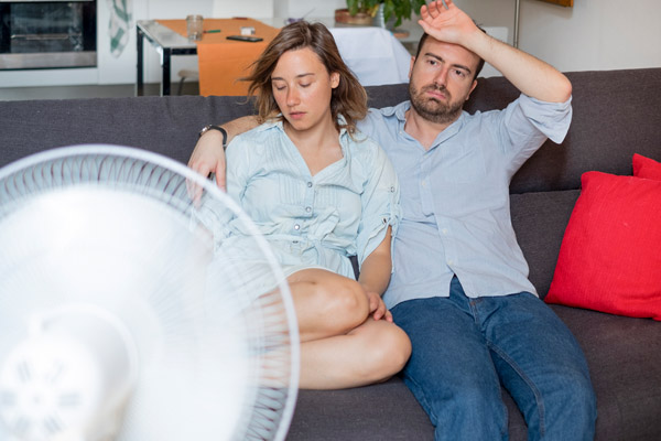 image of a couple that needs an air conditioner repair