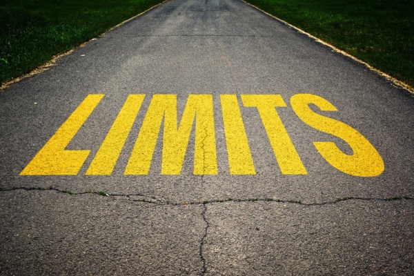 Limits painted on concrete road depicting limitations of traditional forced-air HVAC system