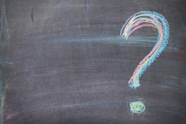 question mark on a chalkboard depicting FAQs about Furnace Heating Oil Smell