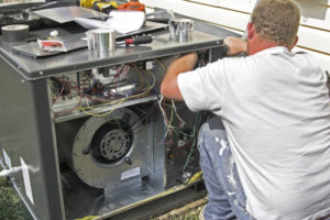 image of an hvac contractor performing an air conditioner installation