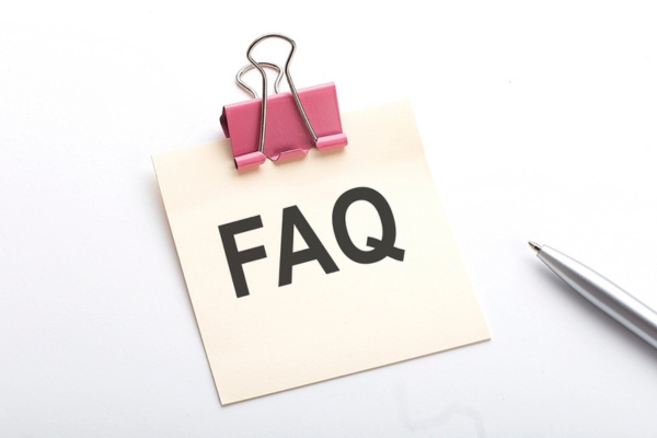 FAQ written on a small paper with a metal clip depicting Questions About HVAC Airflow