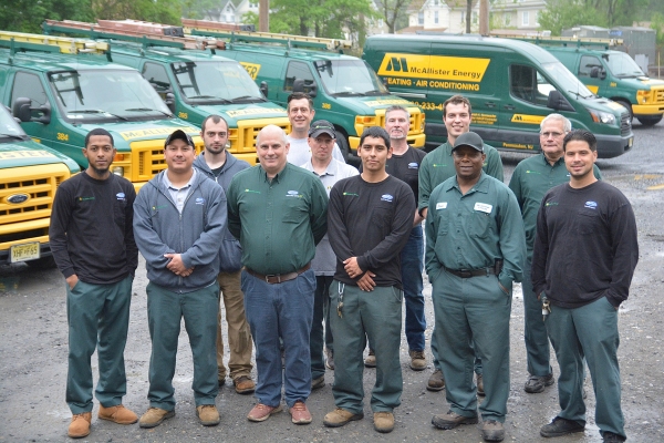 McAllister Energy HVAC team in front of service vans