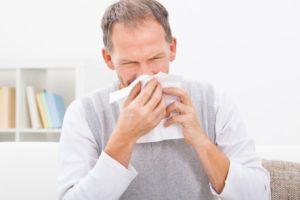 image of a homeowner experiencing allergies