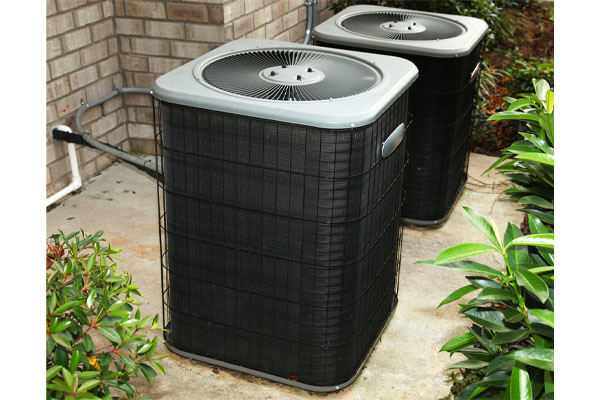 image of an outdoor air conditioning unit in summer