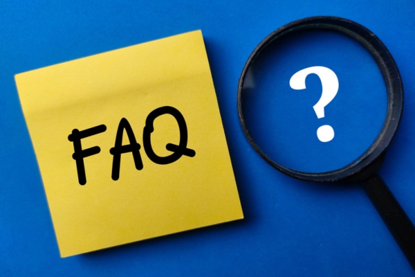 FAQ written on a sticky note beside a magnifying glass depicting questions about How To Size a Standby Generator