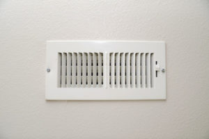 air conditioning vent with ac unit that is blowing smoke