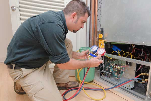 image of an hvac contractor inspecting an old hvac system