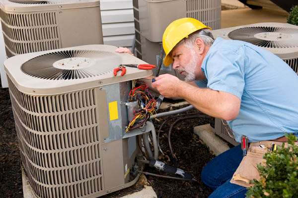 image of an air conditioner compressor repair
