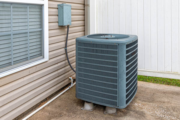 image of an air conditioner compressor that is loud when starting