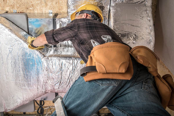 image of hvac ductwork repair by an hvac contractor