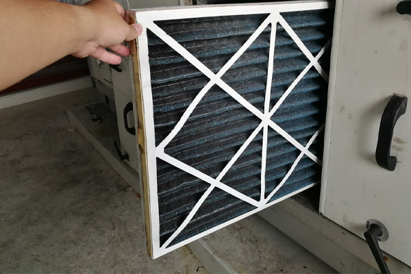 image of an air conditioner filter that is dirty