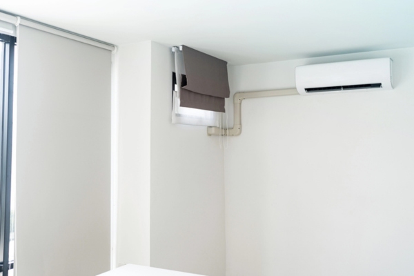 ductless AC indoor unit installed in a bedroom