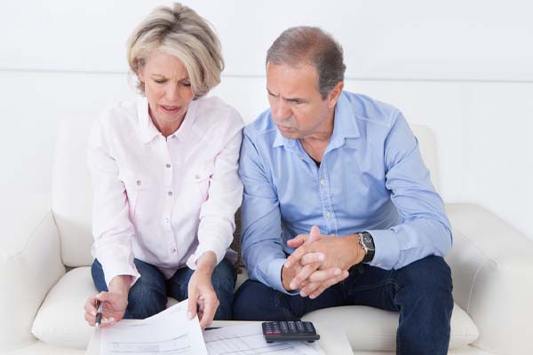 image of a couple calculating fuel costs of a power generator