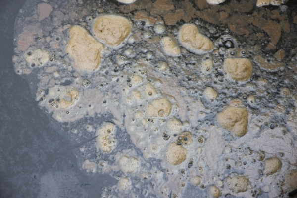 image of dirty liquid depicting sludge on heating oil tank