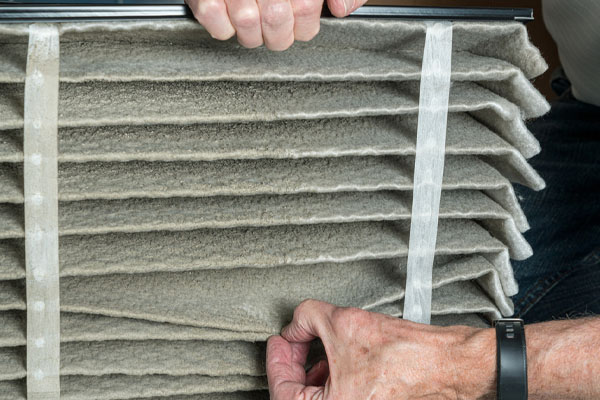 image of a dirty furnace filter and hvac air filter replacement