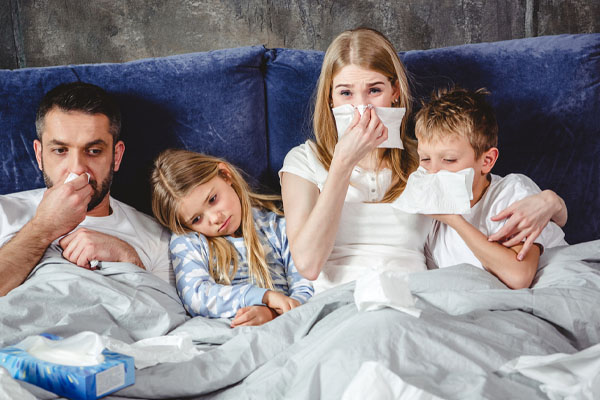 sick family in bed due to indoor air pollution