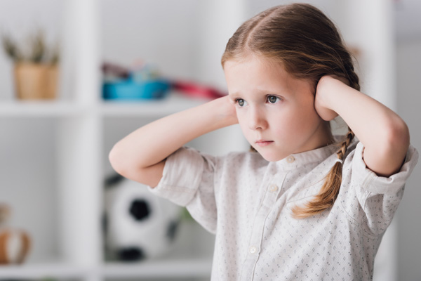 image of a kid covering ears due to unusual hvac noises