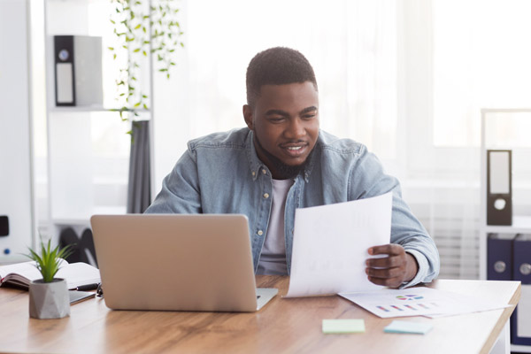 image of homeowner looking at hvac warranty paperwork