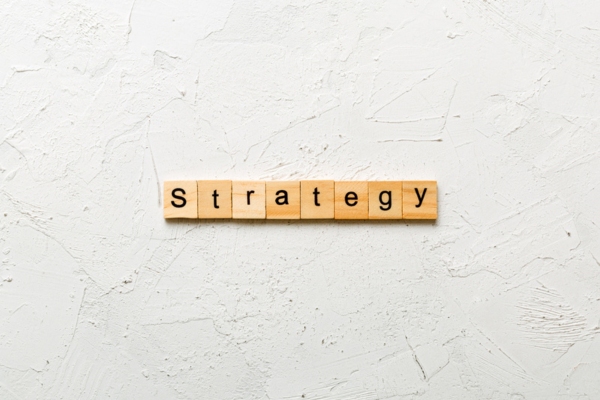 strategy spelled using wooden letter chips depicting ways to deal with AC Condenser Rust