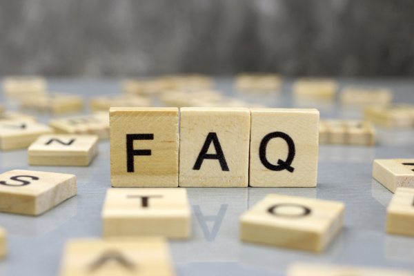 FAQ spelled using wooden letter chips depicting Attic Air Conditioner questions