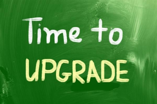 time to upgrade written on a chalkboard depicting air conditioner replacement