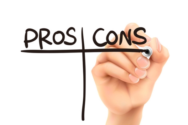 Pros and cons words written by hand depicting ductless heat pumps vs mini-split air conditioners