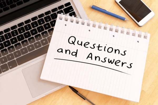 questions and answers written on a notebook depicting Frozen Air Conditioner FAQs