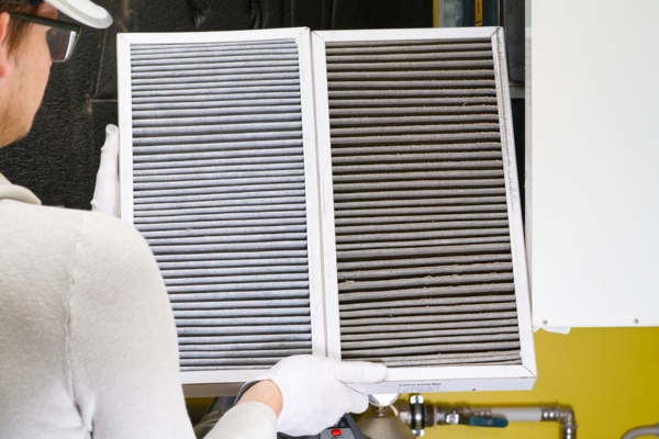 side-by-side comparison of new and old HVAC air filter