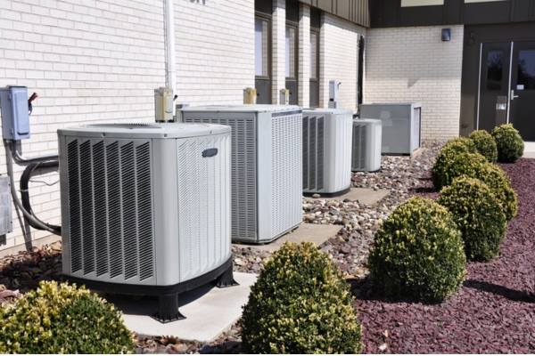 several air conditioning units outside the house installed in one row