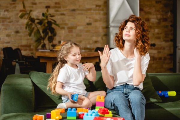 mother and daughter feeling hot indoors due to AC not working properly