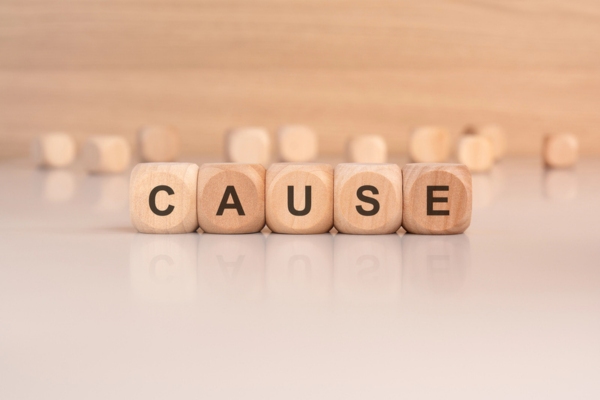 CAUSE spelled using wooden letter dice depicting Backup Generator Startup Failure