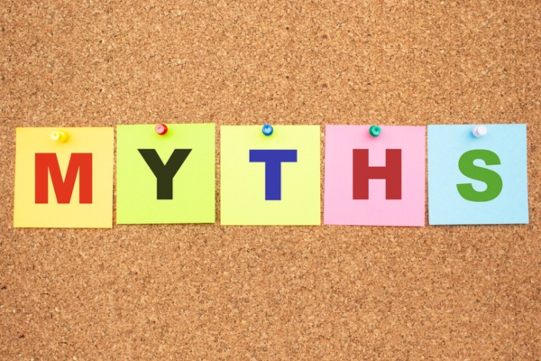 MYTHS written on colored sticky notes pinned on a board depicting heating