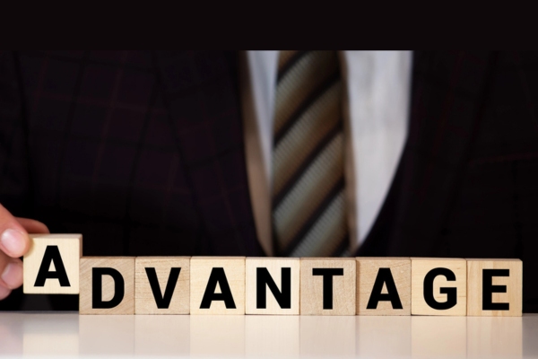 ADVANTAGE spelled using wooden letter cubes depicting heating oil delivery