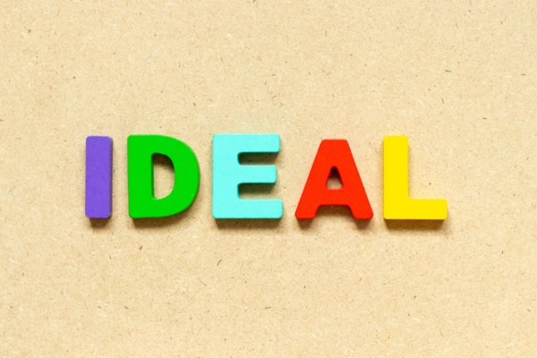 IDEAL spelled using colorful plastic letters