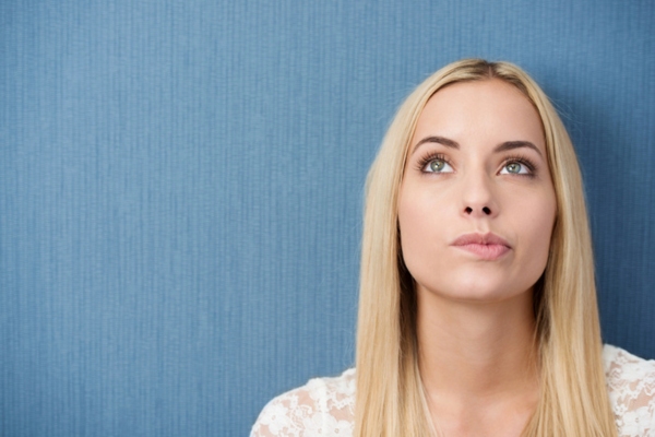 image of a blonde woman thinking depicting When a Backup Generator Installation Makes Sense