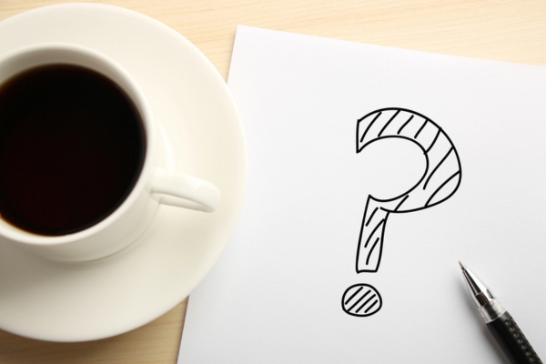 question mark doodle beside a coffee cup depicting FAQs About Summer Power Outages