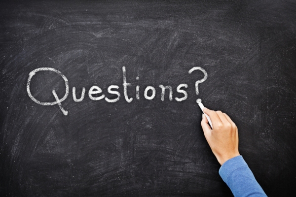 questions written on a chalkboard depicting What Temperature to Set Air Conditioner in Summer FAQs