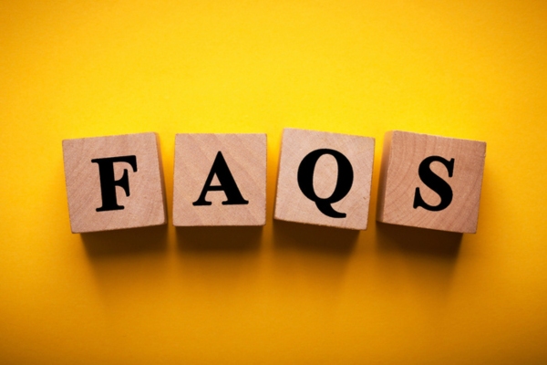 FAQS spelled using wooden letter blocks depicting Air Conditioner Repair questions