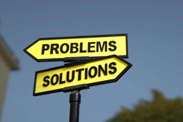 road sign that says problems and solutions depicting air conditioning