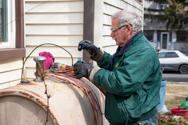 McAllister Energy personnel tending to old heating oil tank