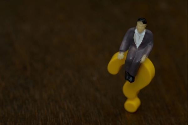 yellow 3D plastic question mark with a man figure on top depicting Home Heating Oil Deliveries FAQs